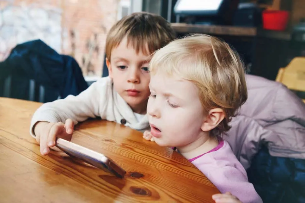 Toddlers at table.