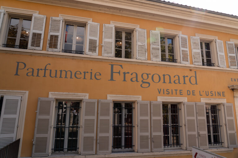 A busy street in Grasse, lined with perfume shops and cafes